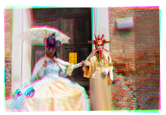 Two figures in Venetian carnival costumes